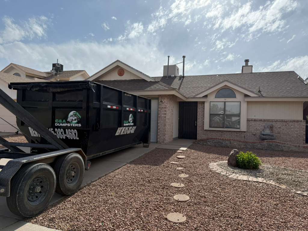C&A Dumpster delivered on a residential driveway