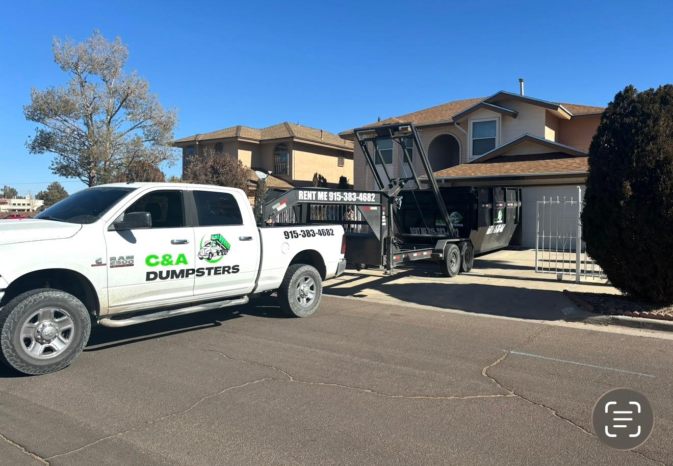 C&A Dumpster carefully placed on a residential driveway in El Paso