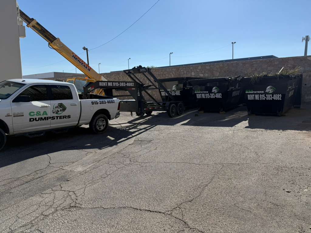 C&A Dumpsters truck delivering multiple roll-off bins